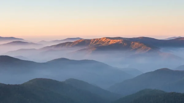Sunlit Mountain Ridge Background